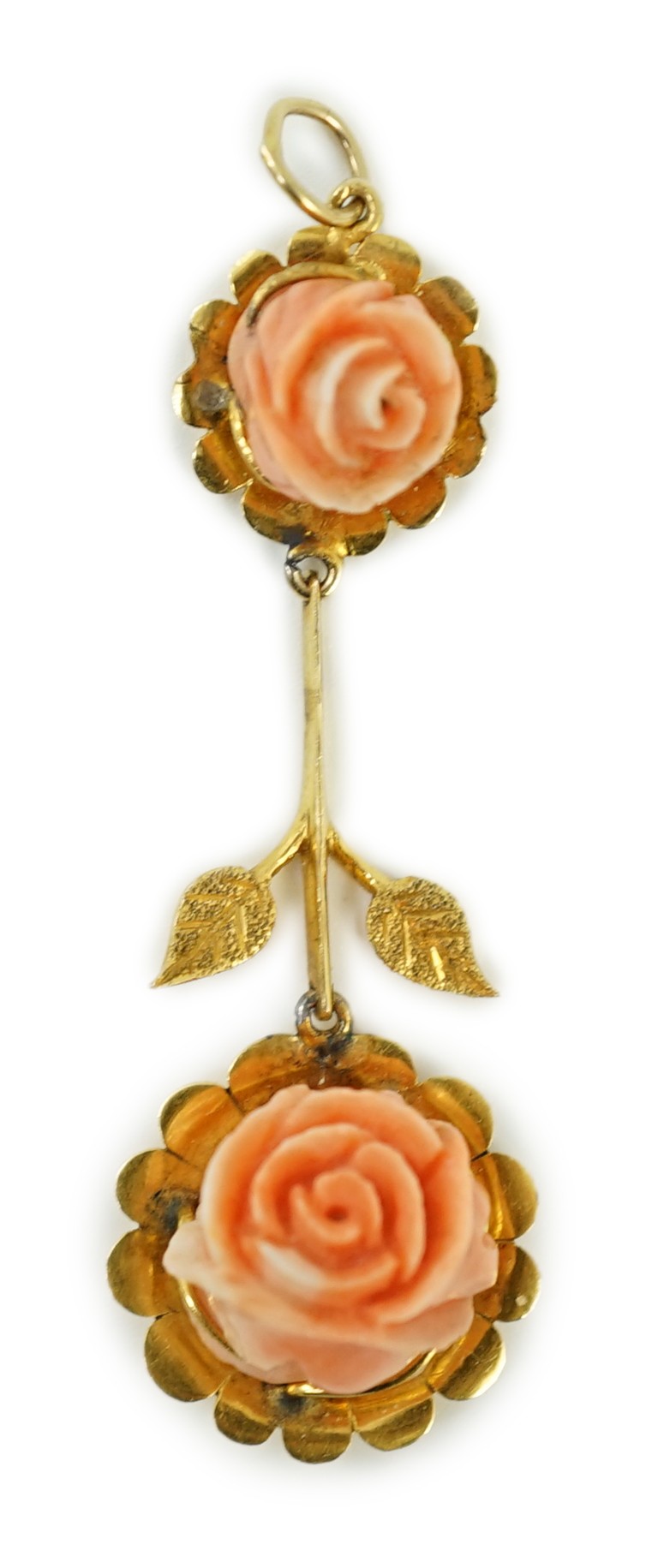 A yellow metal and two stone carved coral set 'rose' drop pendant, overall 57mm, gross weight 6 grams.